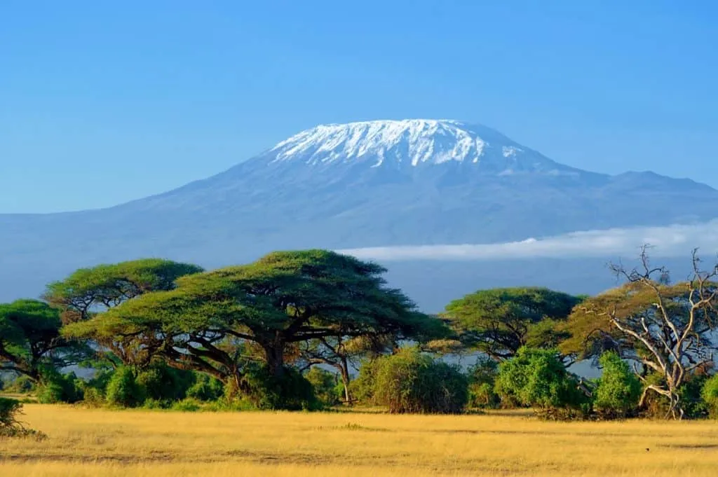 Snow-capped Mount Kilimanjaro rising above the African savannah in Tanzania